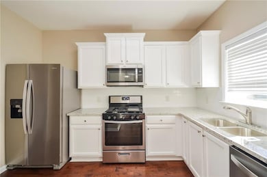 Kitchen with appliances with stainless steel finis