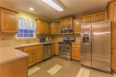 New custom cabinets, solid surface countertops, stainless steel appliances and new tile floors...wow!