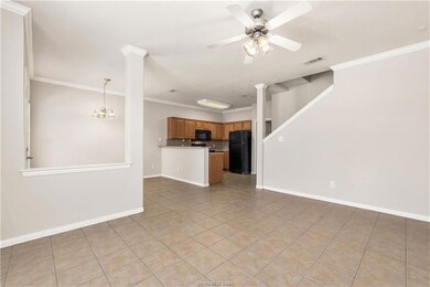 Unfurnished living room featuring light tile patte