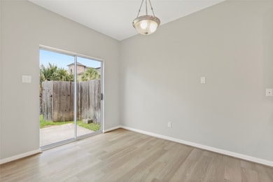Dining space that overlooks at the fenced yard.