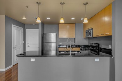 Kitchen with a sink, stainless steel appliances, a