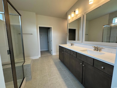 Bathroom with double sink vanity, walk in shower, 
