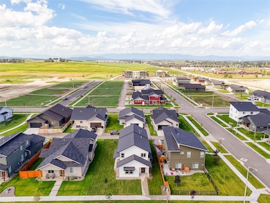 Aerial perspective of suburban area with a mountainous background
