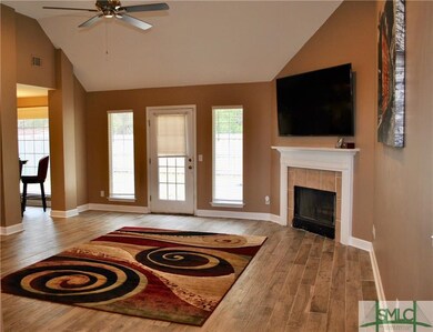 Lofty living room with fireplace makes for a cozy 