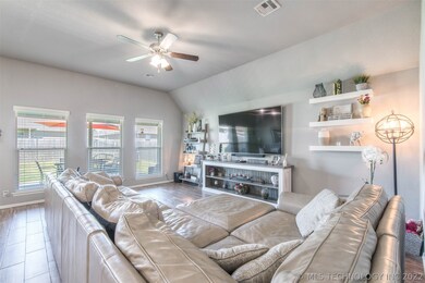 Open floor concept with updated flooring, soft ton