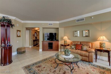 Living room featuring light tile patterned floors,