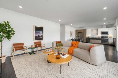 Living area with baseboards, recessed lighting, a