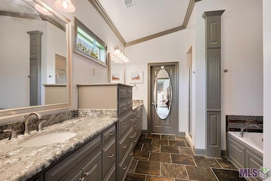 Master bathroom features built in cabinets, beauti