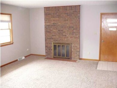 LIVING ROOM WITH WOOD BURNING FIREPLACE, HAS GAS S