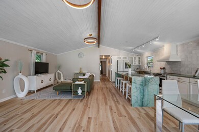 Living room with light wood finished floors, wood