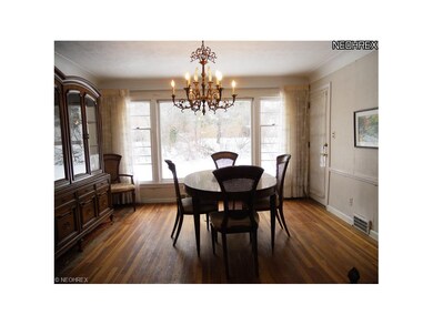 Formal dining Room with hardwood Floors and Door L