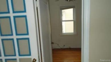 Hall with wood finished floors