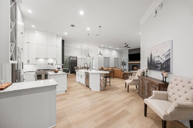 Entering the kitchen and family room. New floors and paint throughout.