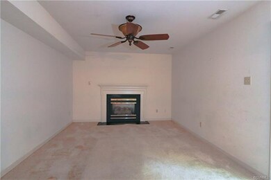 Family room with gas fireplace and ceiling fan