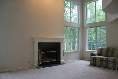 Living Room w/Fireplace & 2 Story Window