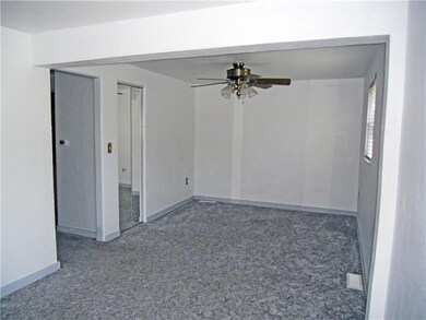 Large living room with hallway to kitchen