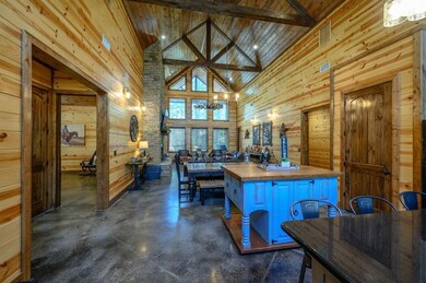 Kitchen featuring a chandelier, wood walls, butche