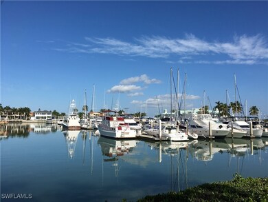 Property view of water with a boat dock