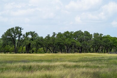 View of tree filled area featuring a view of coun