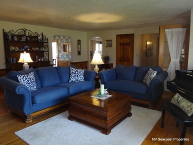 Sizable & open Living room with working wood burning fireplace.
