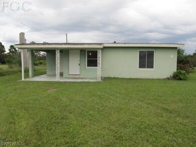 House is a concrete block with double pane windows