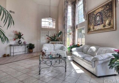 Dramatic wall of windows adds to the elegant livin