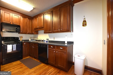 Good cabinets, plenty of room and stove, refrigerator and dishwasher remain.