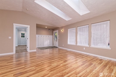 Beautiful big living room with LPV flooring. That's the Primary bedroom off to the left.