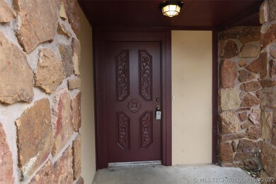 Front entry has newly painted front door.