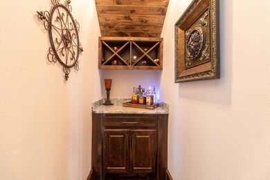 The dedicated cocktail bar is conveniently tucked away just off of the living space!