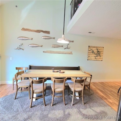 Set up with large dining table.