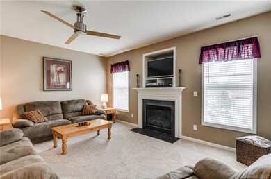 Great room with new carpet, and cozy gas log firep