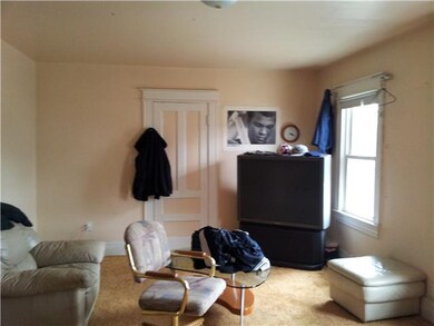 Living Room. Upstairs unit living room. Entrance t