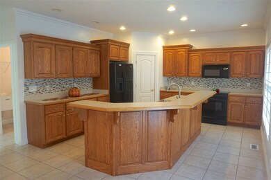 Tiled Backsplash, abundance of cabinets and counte