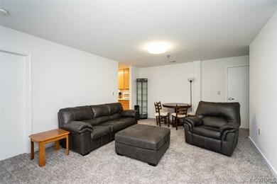 Living room featuring light colored carpet