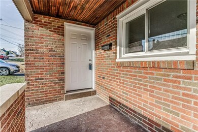 Front covered porch and entry door