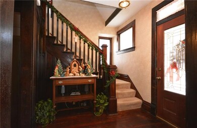 Beautiful front door leads to entry with original 