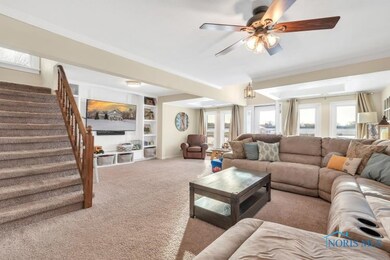 Huge living room with stairway to the upper level.