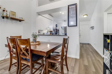 Dining space featuring visible vents, light wood-s