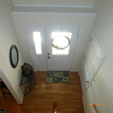 Front entry foyer with wood floors.
