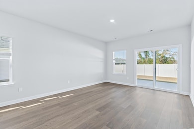 Unfurnished room with hardwood / wood-style floori