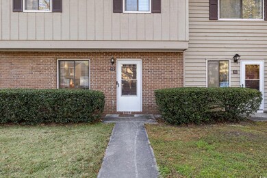 Property entrance with a lawn