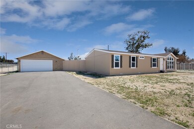 View of oversized garage and new driveway.