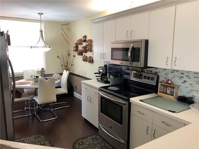 Kitchen with back splash, stainless steel applianc