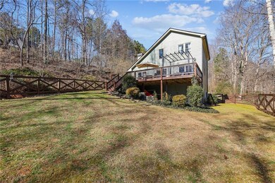Rear view of property featuring a fenced backyard,
