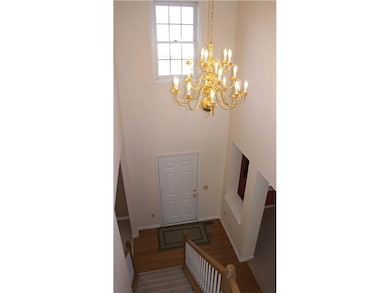 Entry. Two story foyer with hardwood floors.