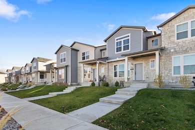 View of front of house featuring a residential view, stone siding, and a front yard