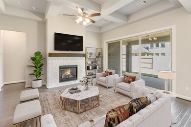 Gather the family and guests together in your lovely living room! Featuring high ceilings, dark stained ceiling fan, custom paint, gorgeous floors, fireplace with mantel and large windows that provide plenty of natural lighting throughout the day.
