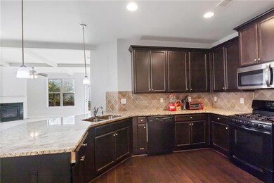 Kitchen featuring dark hardwood / wood-style floor
