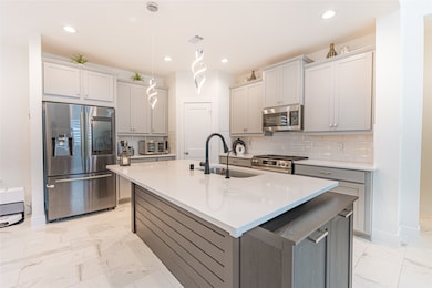 Kitchen with large Island and quartz counters